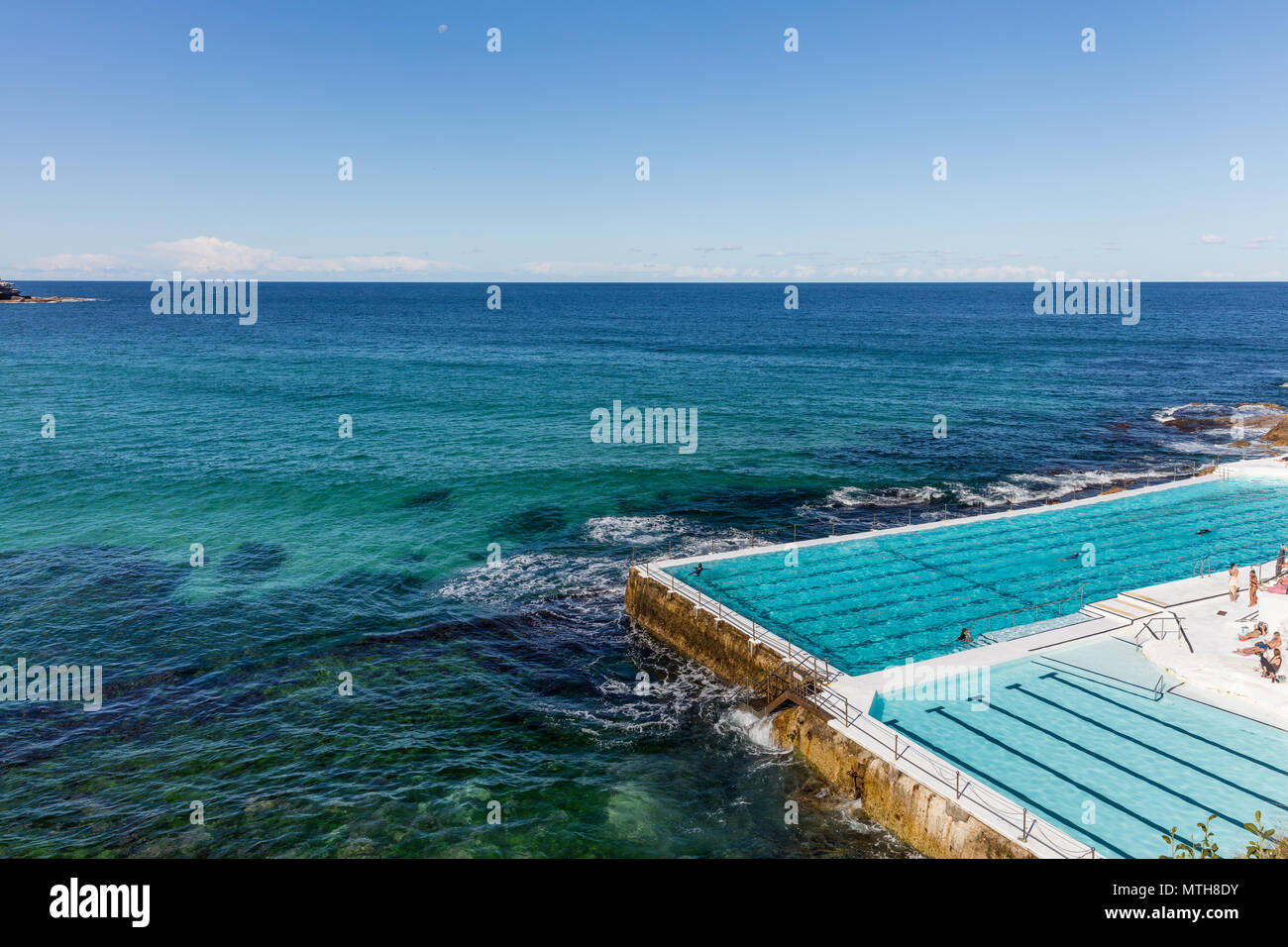 Unrecognisable wimmers at swimming pool overlooking Bondi beach in Sydney, NSW, Australia Stock Photo