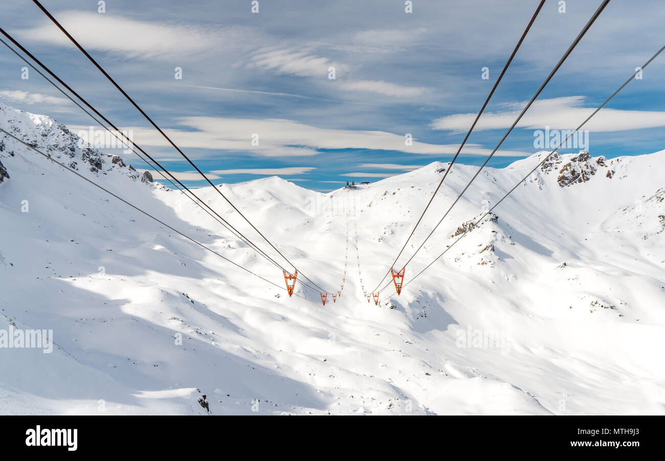 ski lift in arosa switzerland blue sky winter Stock Photo