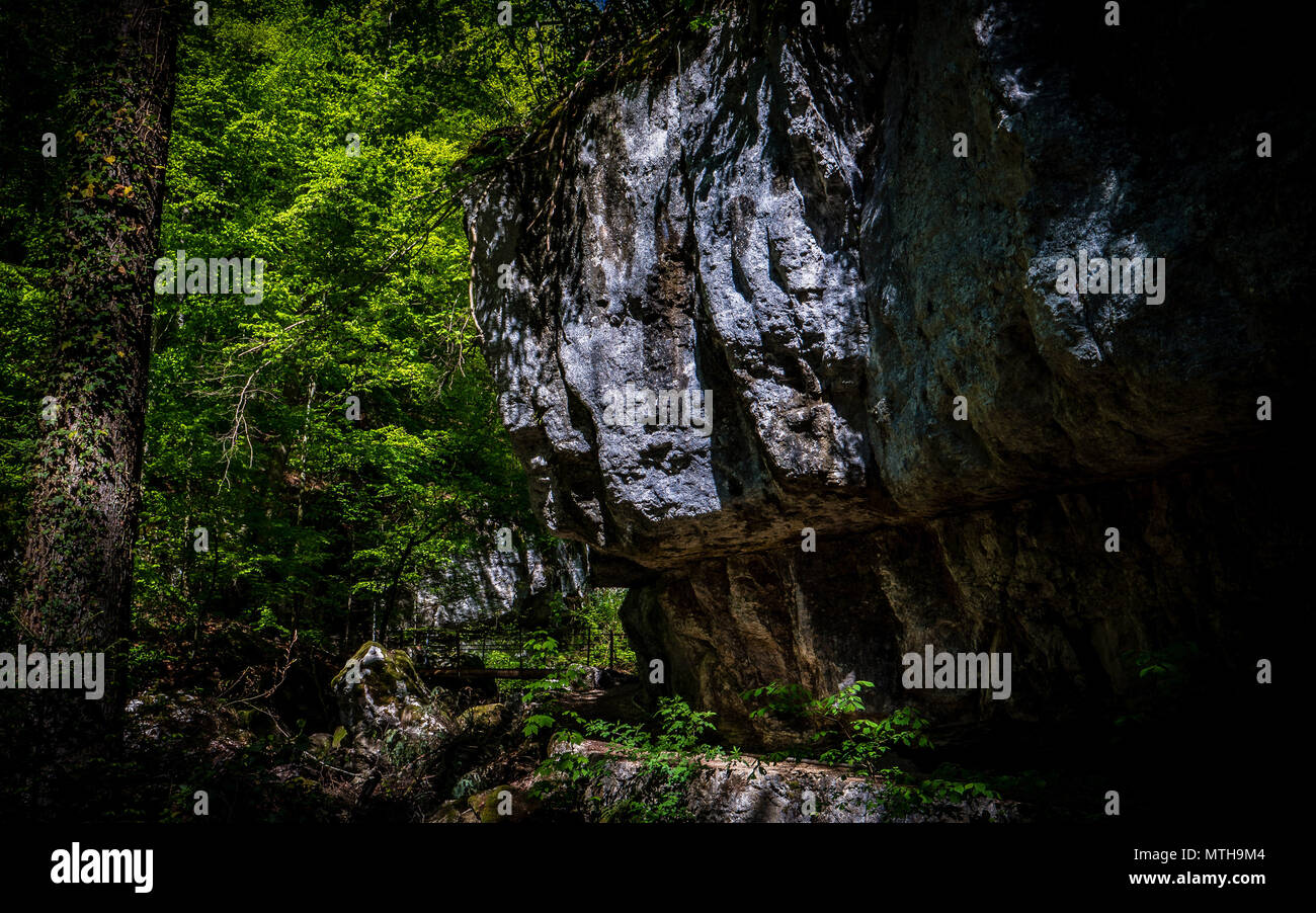 path through big stone, mystery hiking Stock Photo