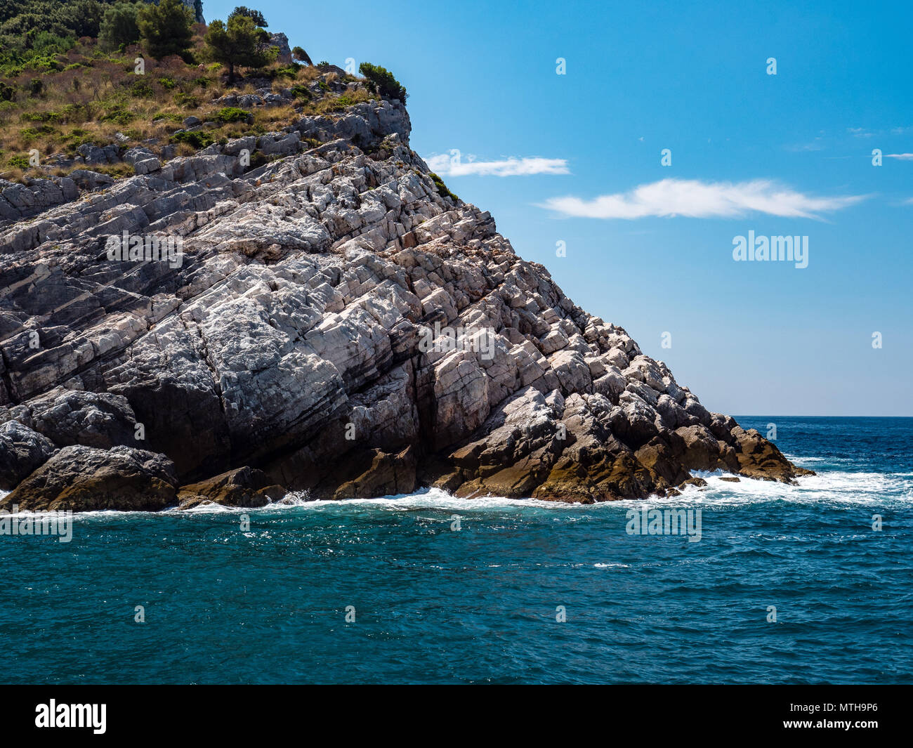 coast with cliff and rocks, italy Stock Photo - Alamy