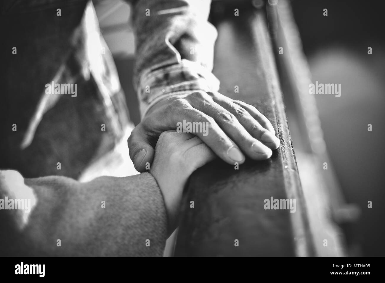 Hand in hand. Man and woman holding by hands in the city Stock Photo