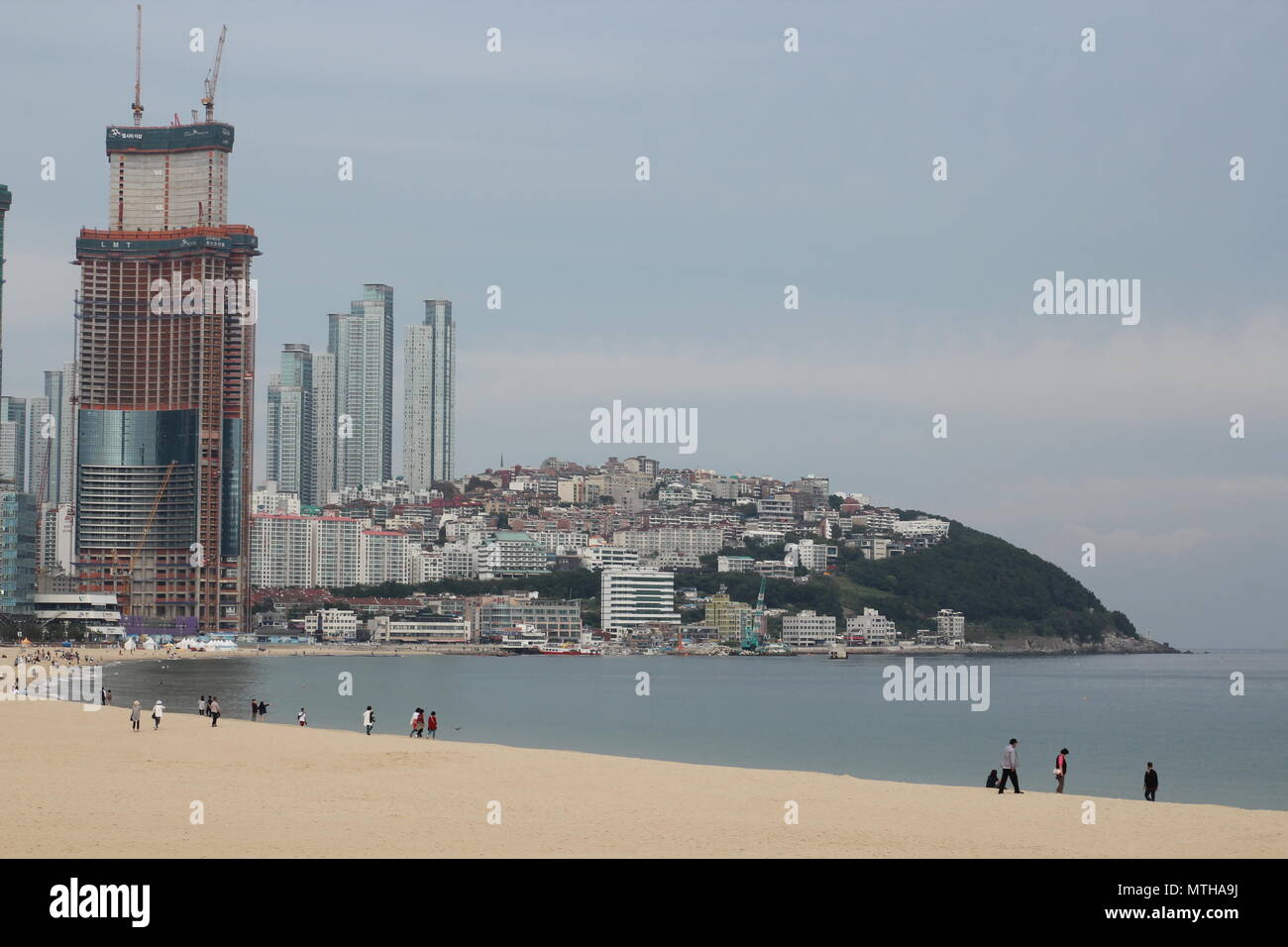Busan, South Korea - Sept 7, 2017 : Haeundae beach, with the view of Haeundae LCT The Sharp under construction. Stock Photo