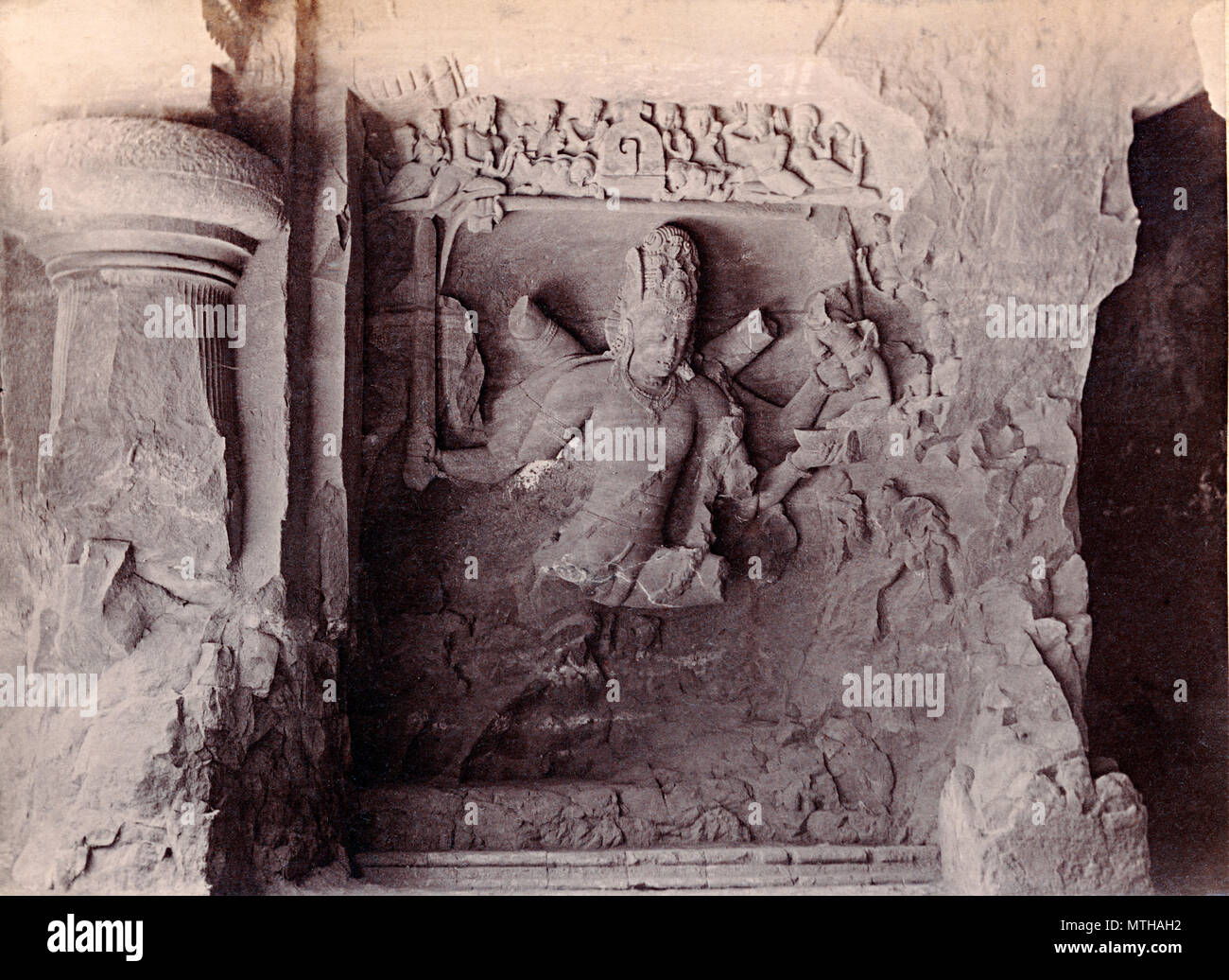 Shiva the destroyer killing the demon Andhaka, carved stone in Elephanta Caves, India, about 1890 Stock Photo