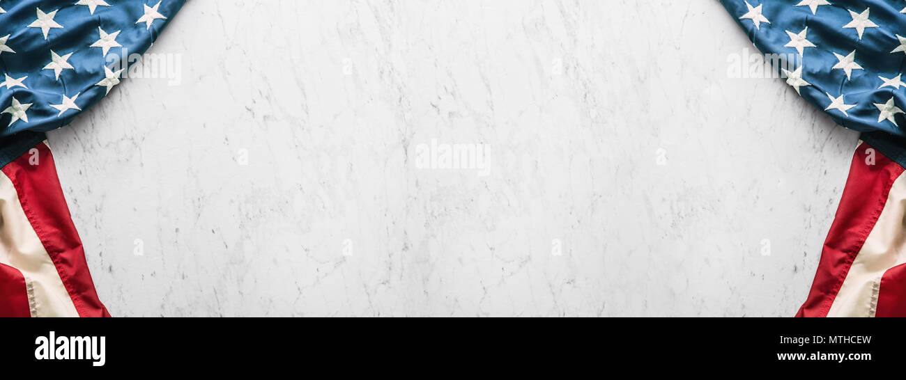 Close-up american flag on white marble background. Stock Photo