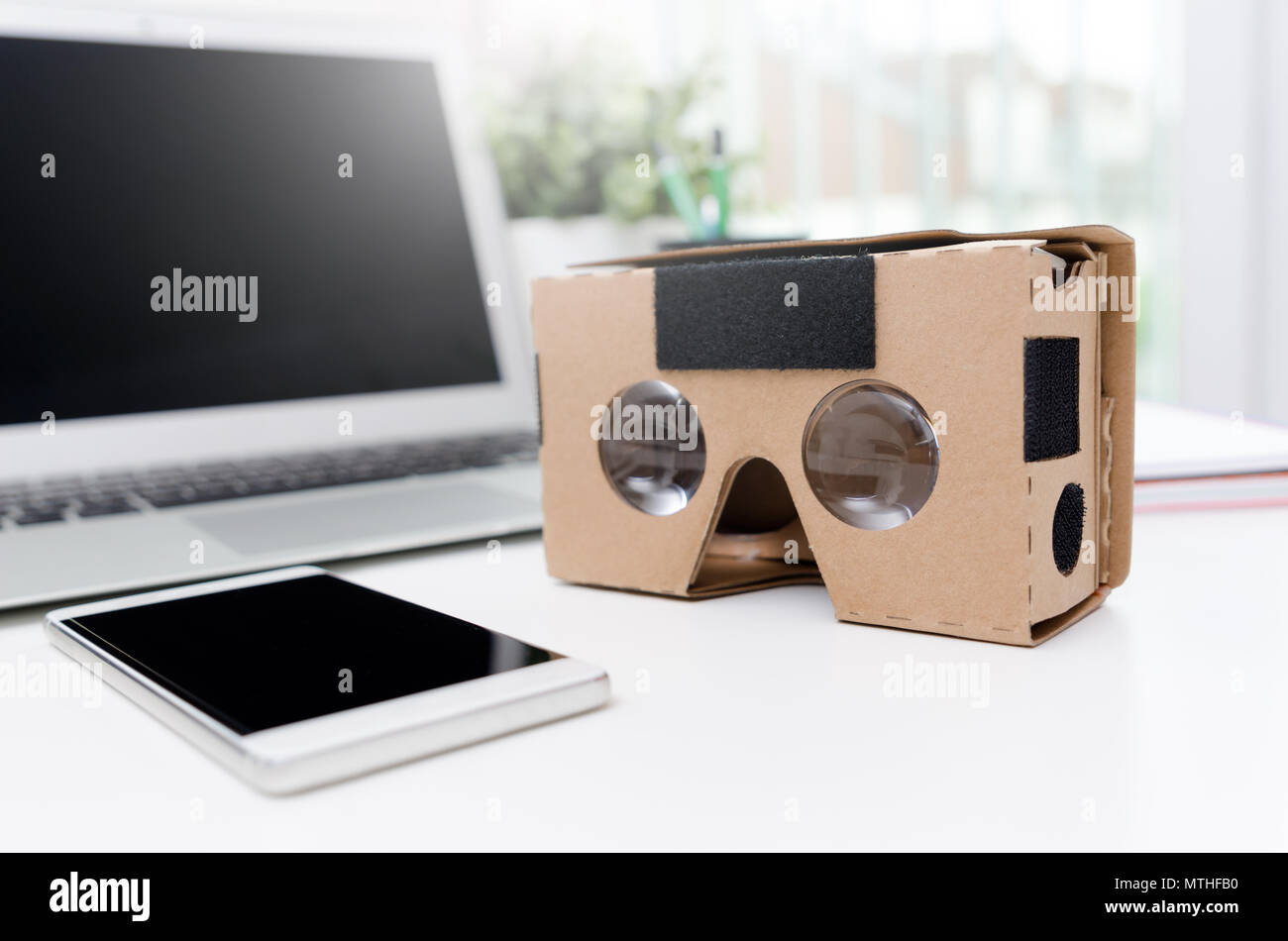 Virtual reality cardboard glasses. Easy way to watch movies and play