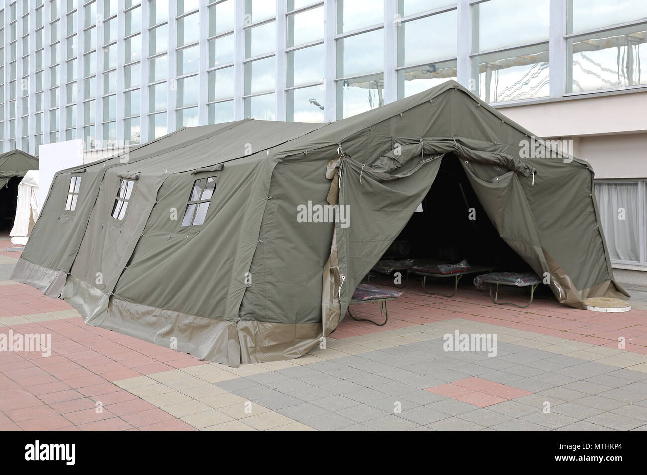 Green Tent Temporary Shelter for Disasters and Refuge Stock Photo