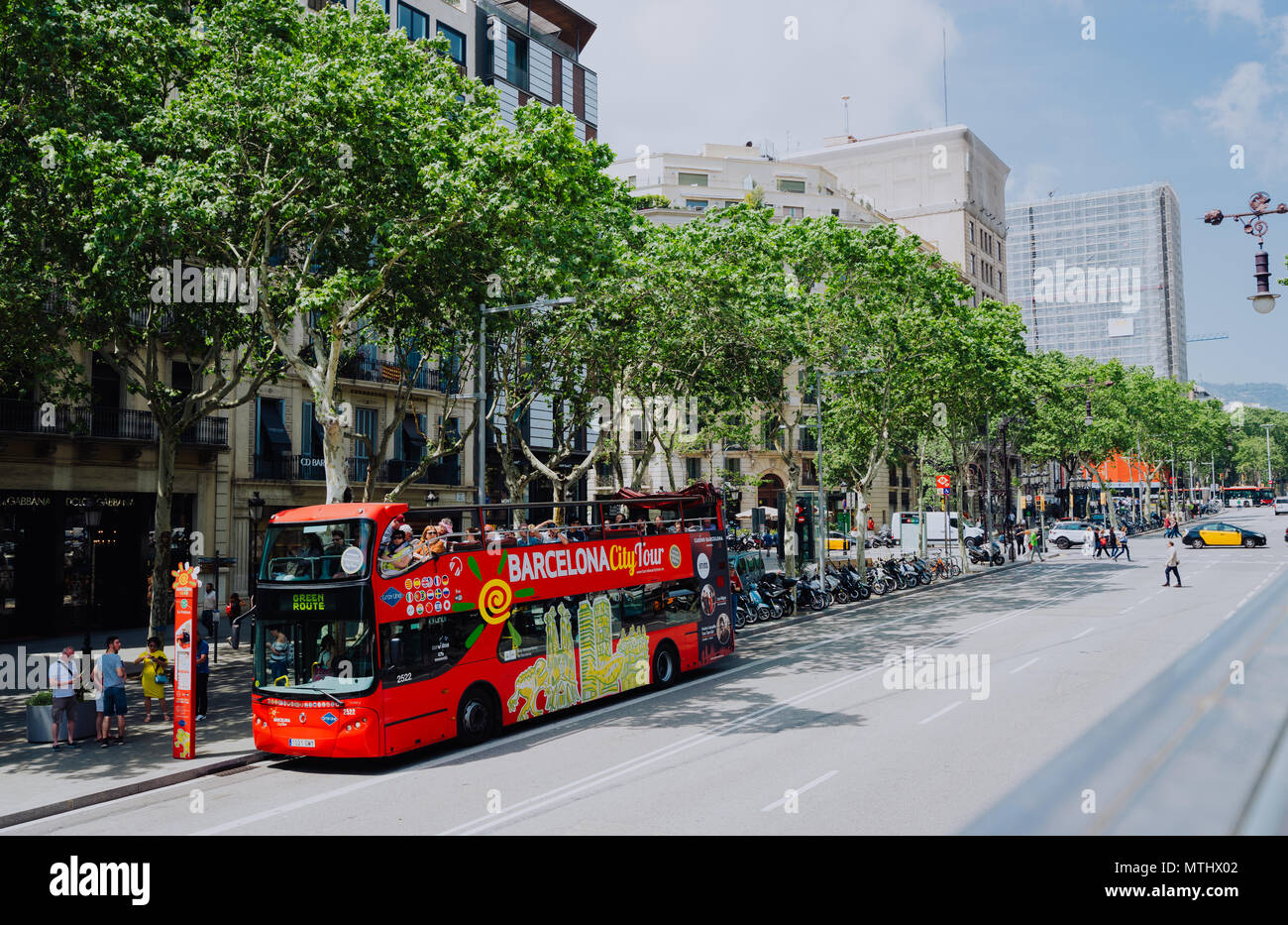 BARCELONA, SPAIN - April 26, 2018: Barcelona city tour touristic bus with  tourists on the route around Barcelona, Spain Stock Photo - Alamy