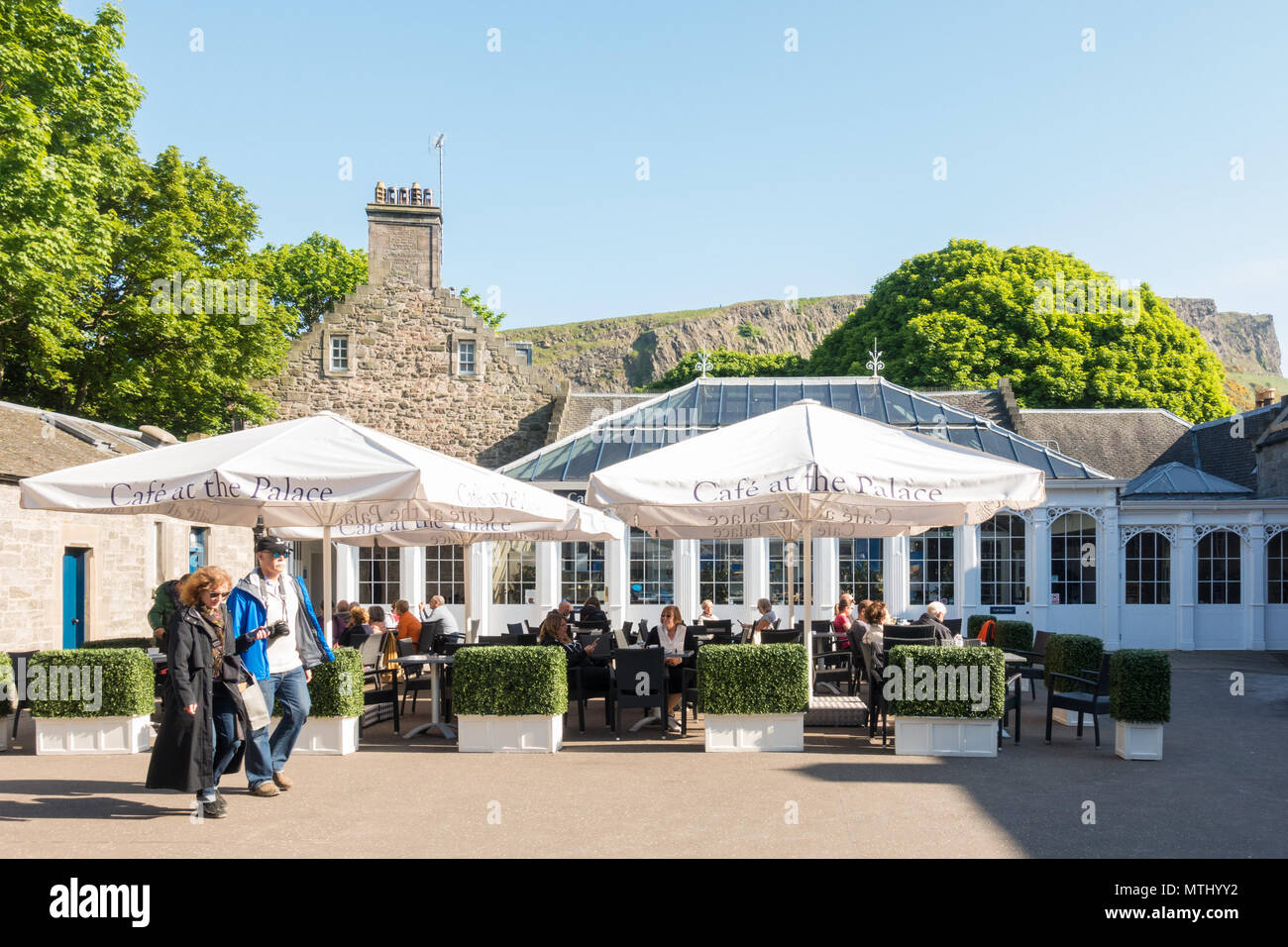 Holyrood Palace cafe - Cafe at the Palace, Mews Courtyard, Canongate, Edinburgh, Scotland, UK, with Salisbury Crags behind Stock Photo