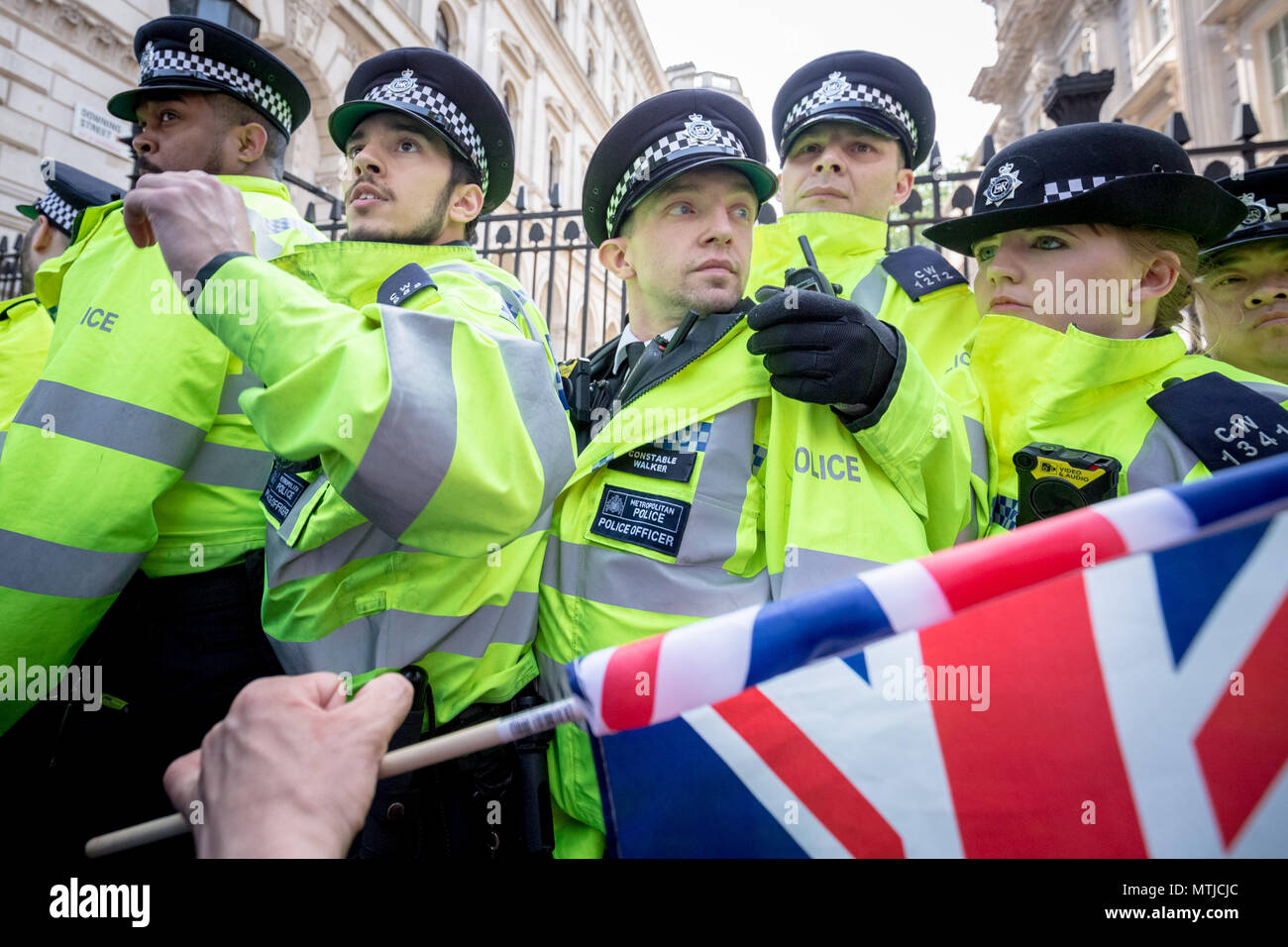 Nationalist supporters of Tommy Robinson protest opposite Downing Street in London against his recent imprisonment for contempt of court. Stock Photo