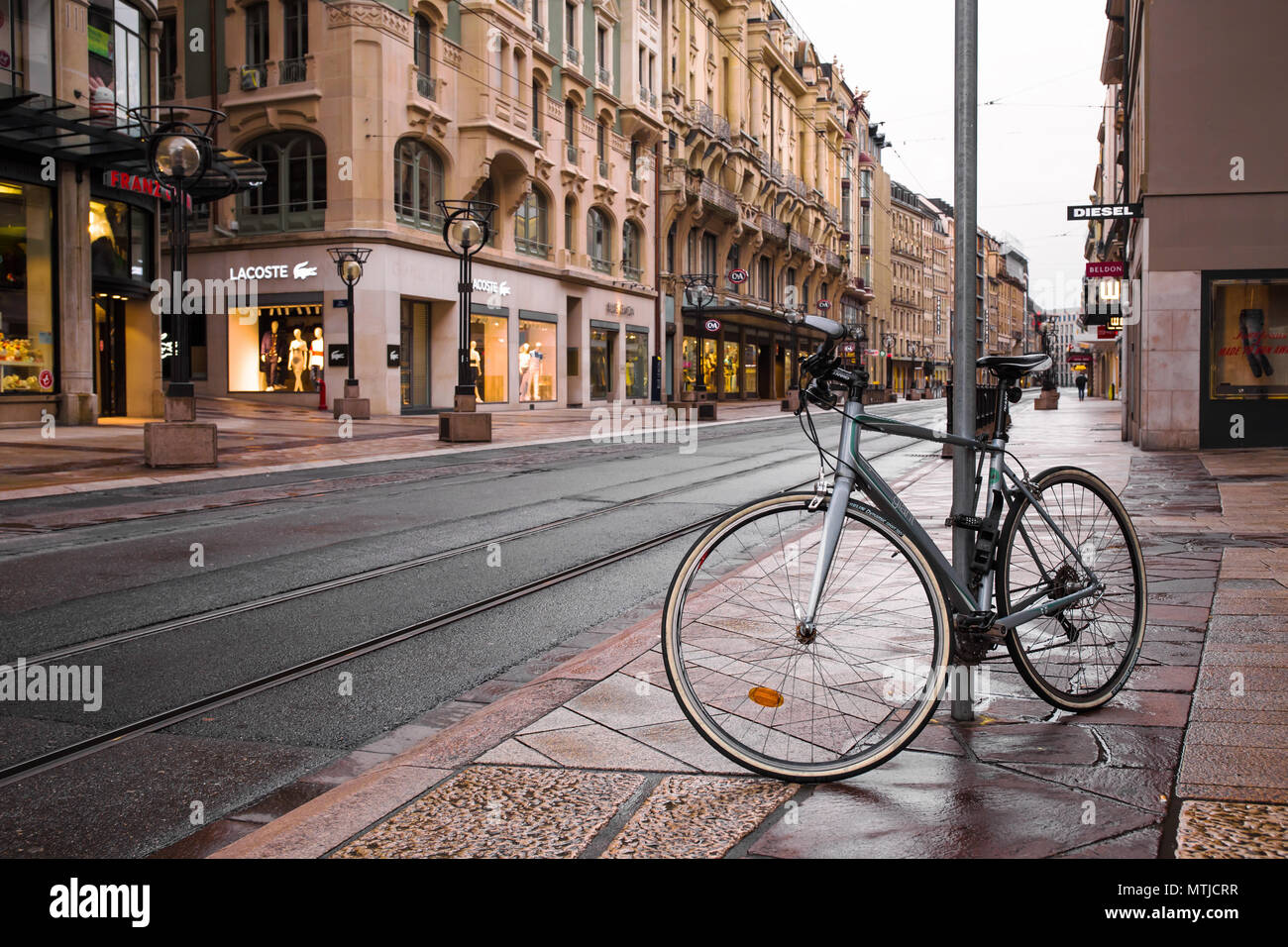 Bicycle on street in Geneva Stock Photo Alamy