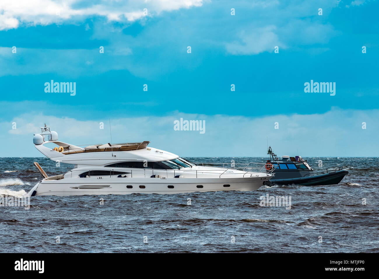 White speed boat moving fast to the Baltic sea. Water sport Stock Photo ...