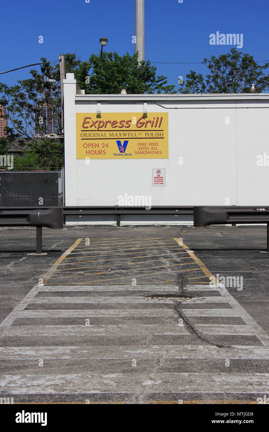 White painted pedestrian walkway leading to the back of the Express Grill Restaurant in Chicago, Illinois in May 2018. Stock Photo