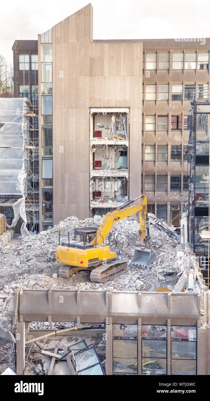 building site with heavy machinery knocking down a building to make way for something new Stock Photo