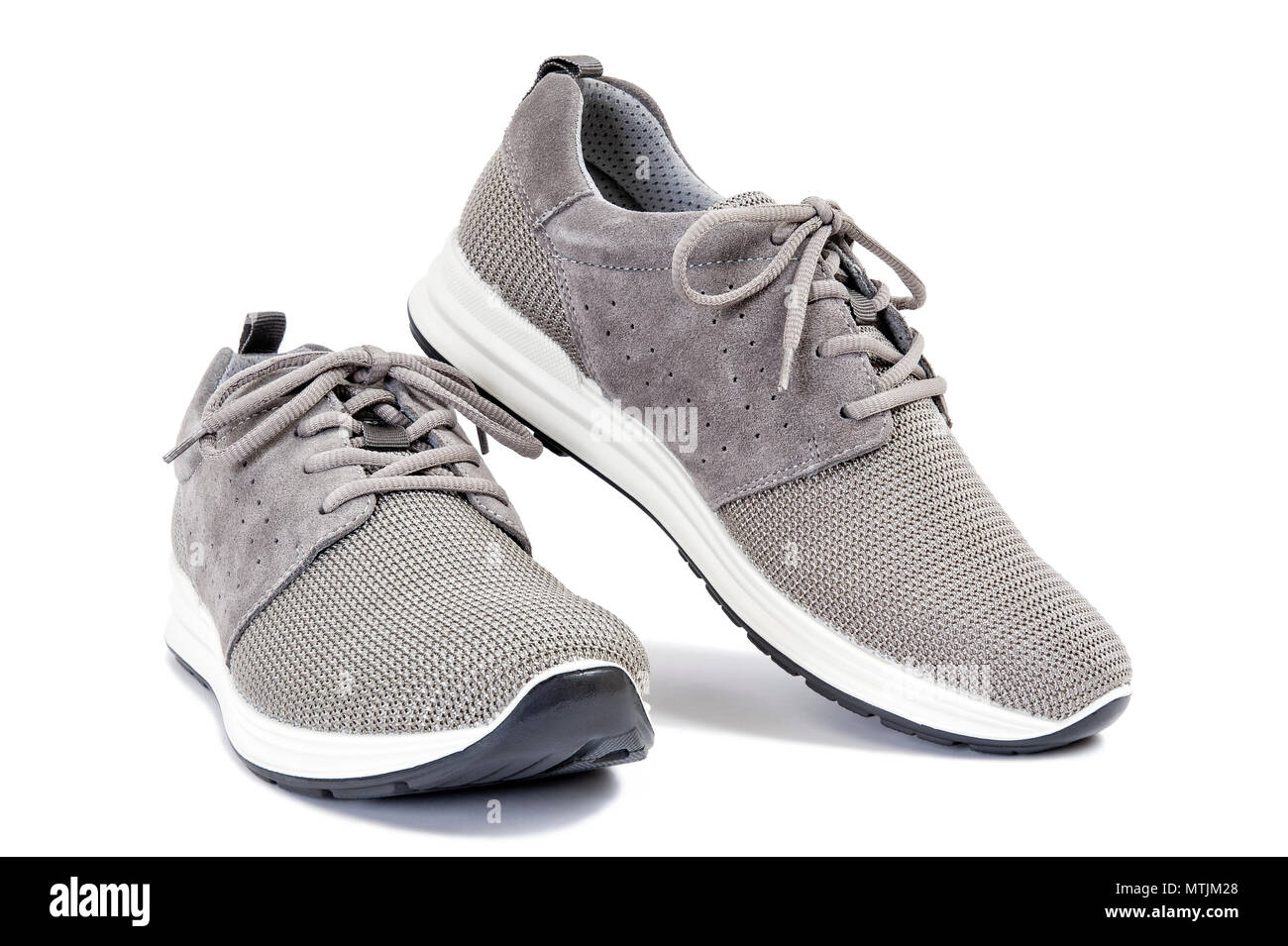 Close-up of elegant gray sport shoes for adult man photographed on white  background Stock Photo - Alamy
