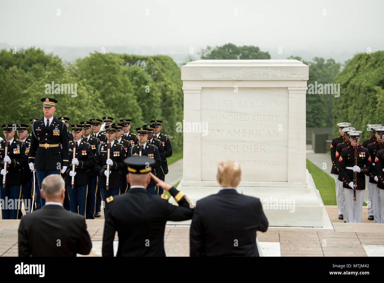 President Donald J. Trump lays a wreath at the Tomb of the Unknown Soldier during a Memorial Day ceremony with Secretary of Defense James N. Mattis and Chairman of the Joint Chiefs of Staff Marine Gen. Joseph F. Dunford Jr., at Arlington National Cemetery in Arlington, Va., May 28, 2018. (DoD photo by Army Sgt. Amber I. Smith) Stock Photo