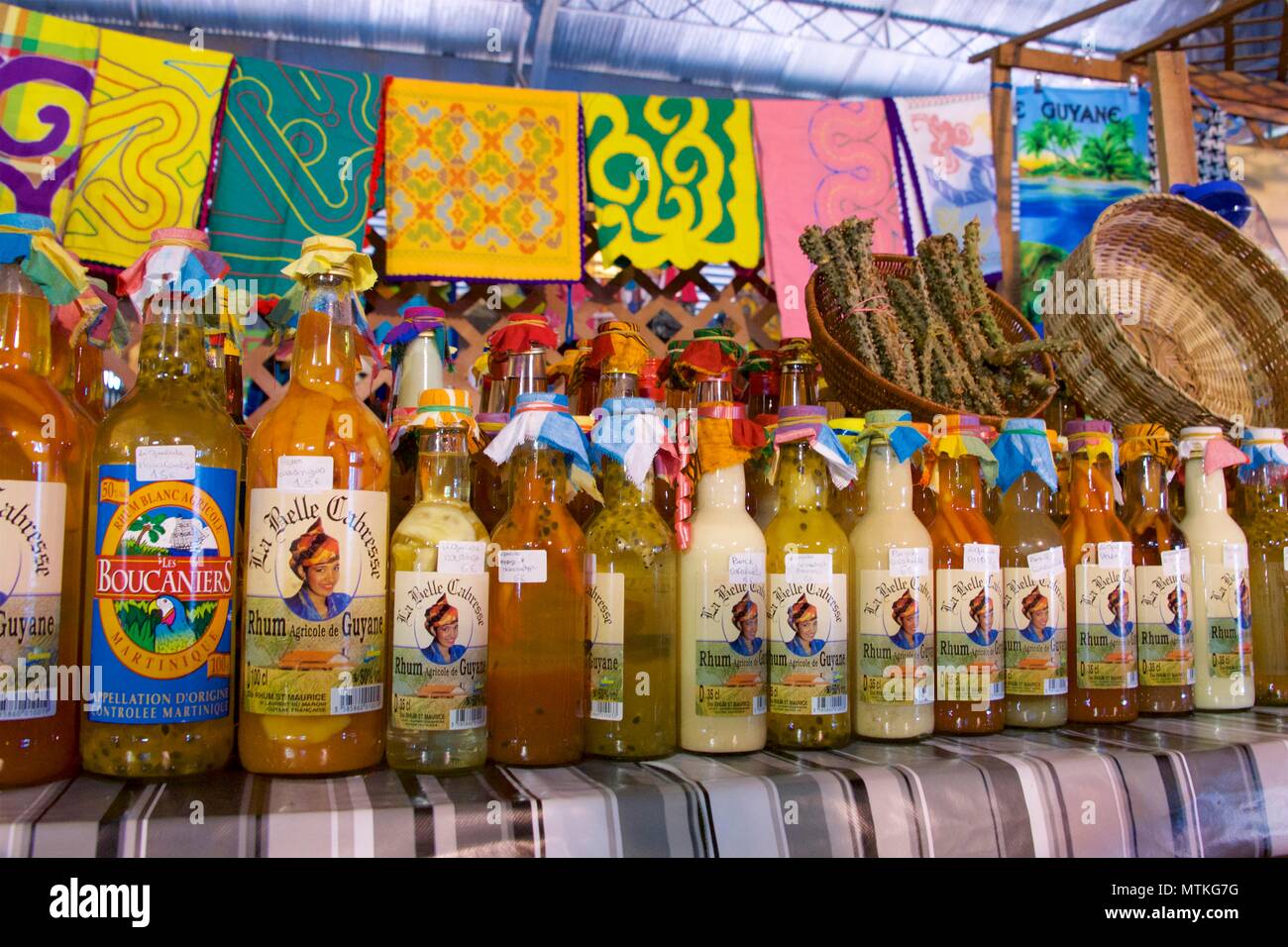 Fruit infused rum on sale in the central market of Cayenne, French Guiana Stock Photo