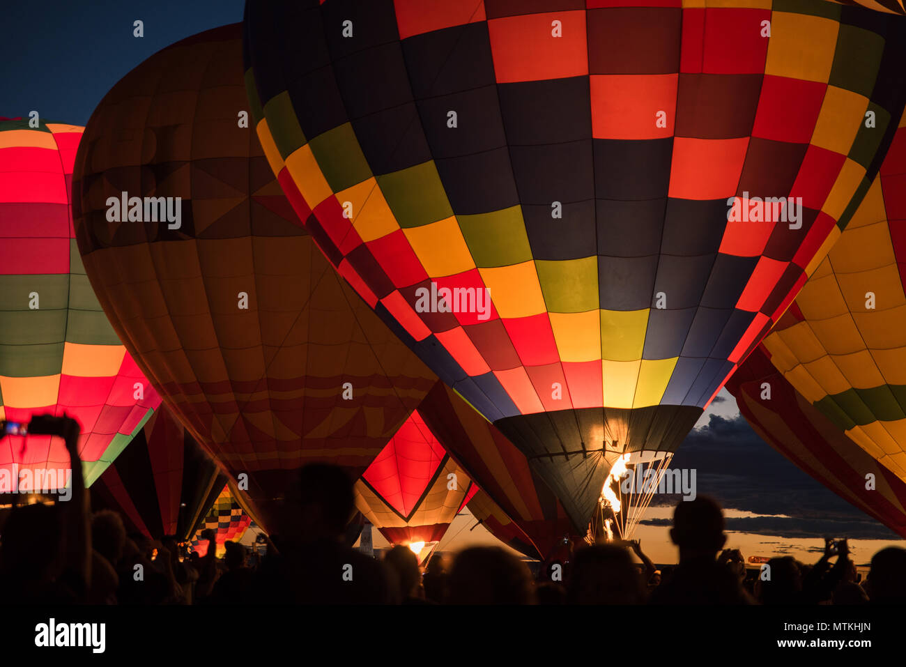 Colorful hot air balloons lit up in the night in Albuquerque, New Mexico. Stock Photo