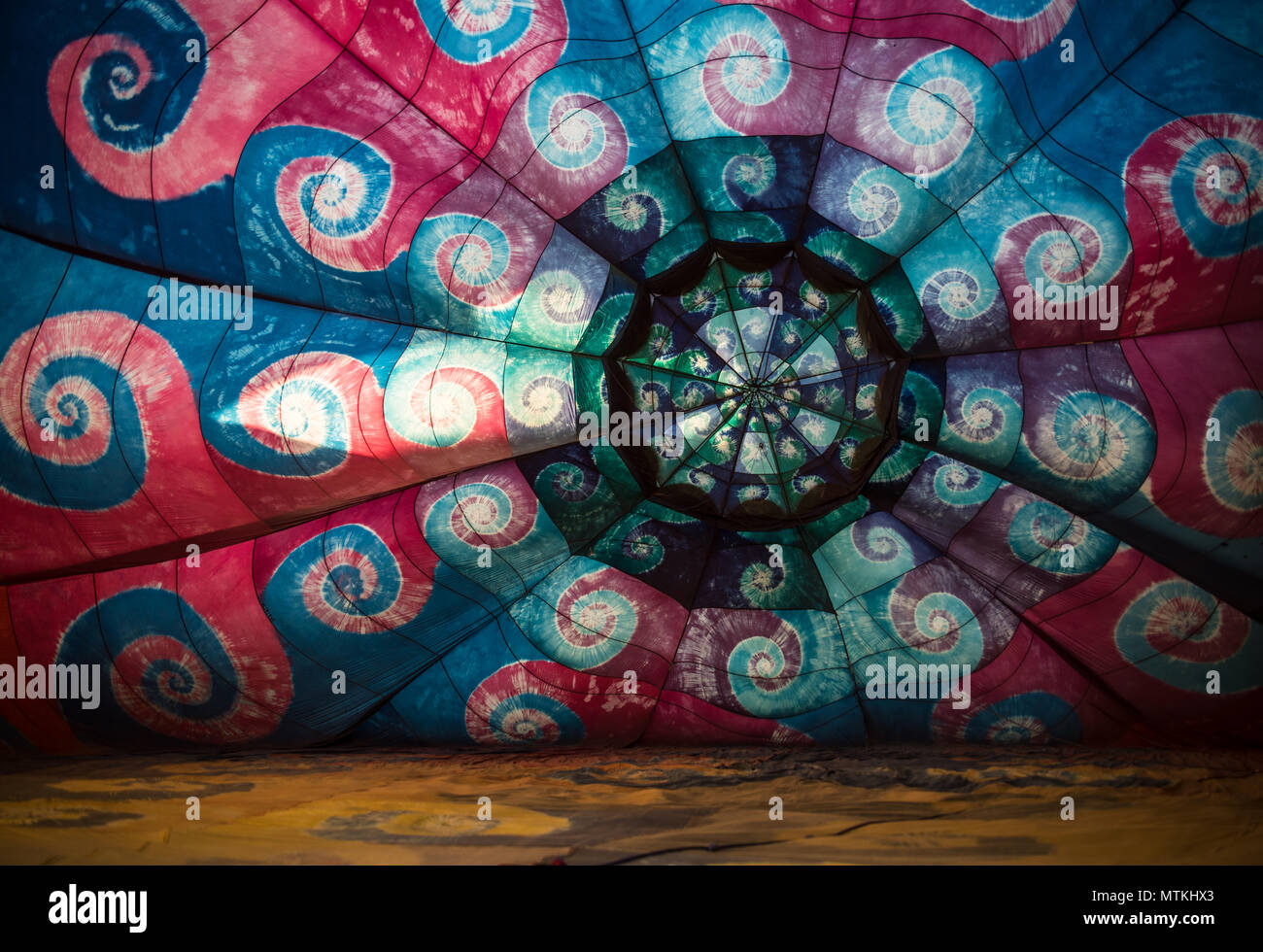 Close up on a design on a hot air balloon near the ground. Stock Photo