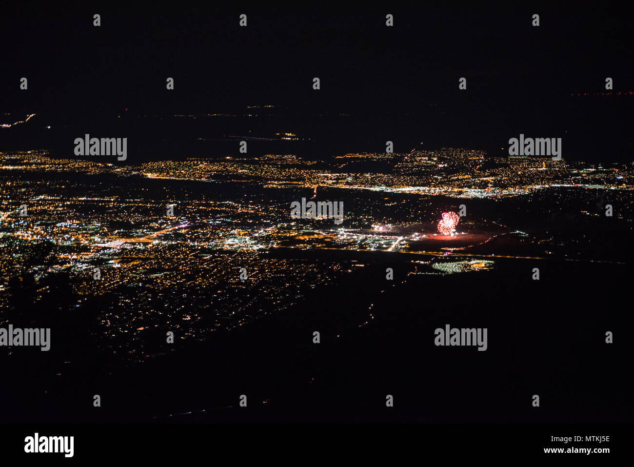 Scenic view over Albuquerque, New Mexico at night during a firework show. Stock Photo