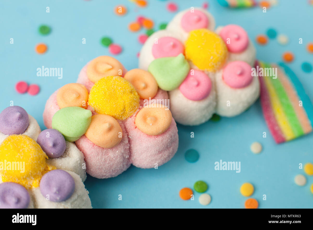candies with jelly and sugar pattern. colorful array of different childs sweets and treats. Bright party background, kids sweetness flowers marmalade Stock Photo