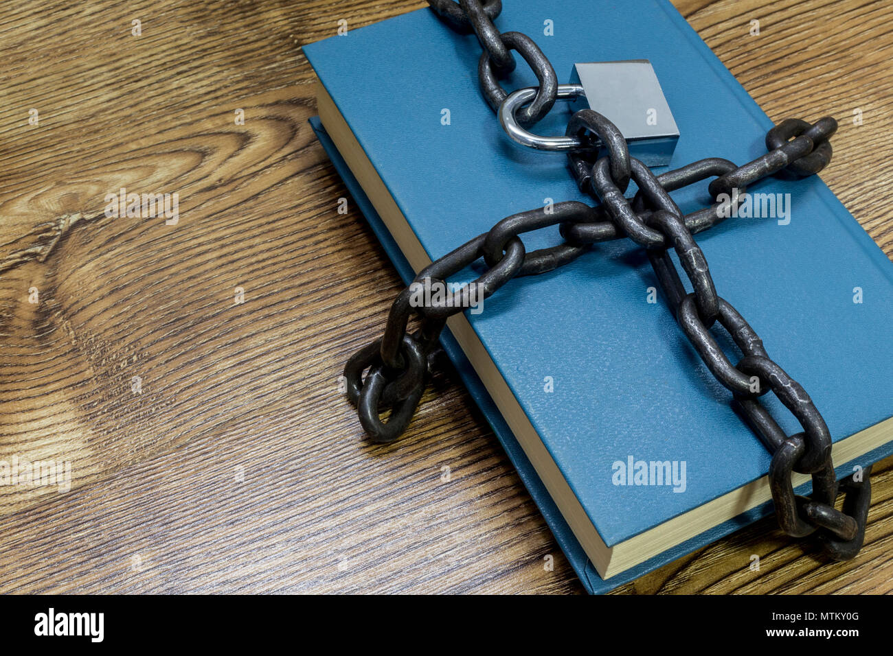 Information security concept, book with chain and padlock Stock Photo