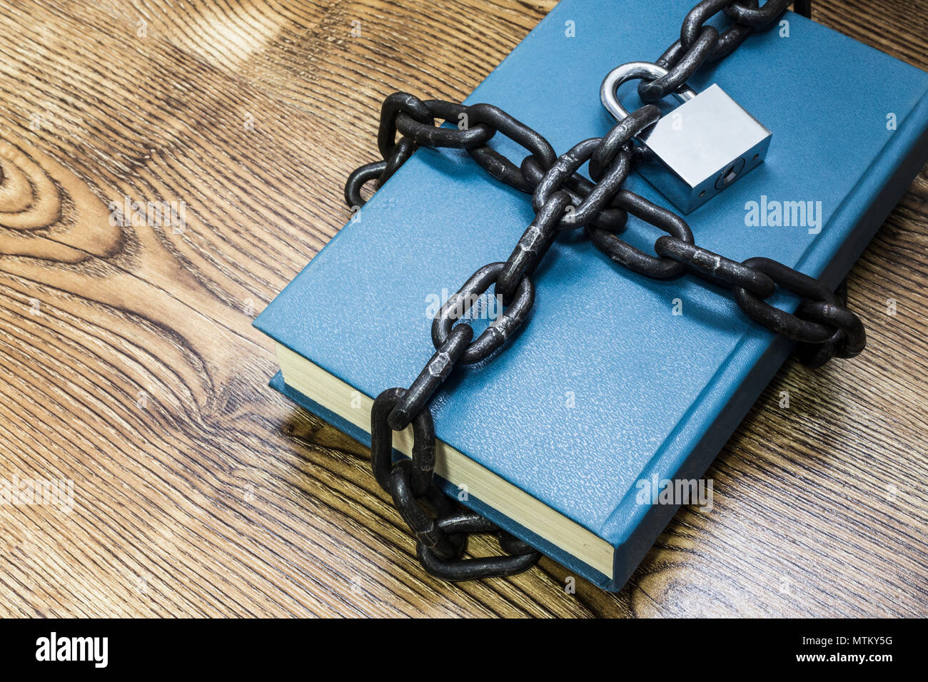 Information security concept, book with chain and padlock Stock Photo