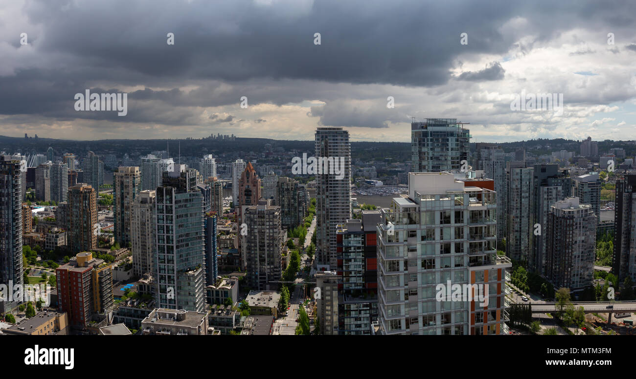 Aerial panoramic view of a beautiful modern cityscape during a cloudy ...