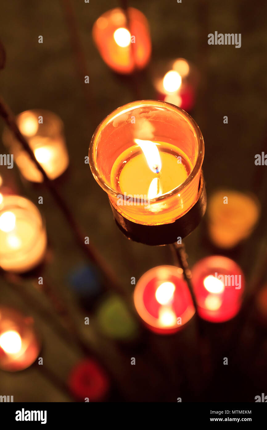 Candles In Red Orange And Yellow Transparent Chandeliers Stock Photo Alamy