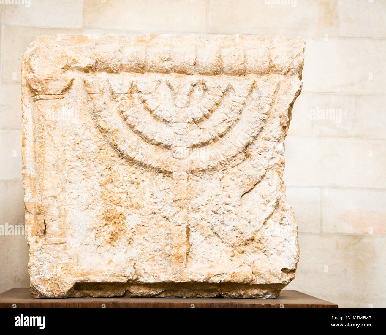 Stone Lintels decorated with seven-branched Menorah candelabrum.That is one of the oldest symbols of the Jewish people, Jerusalem, Israel Stock Photo