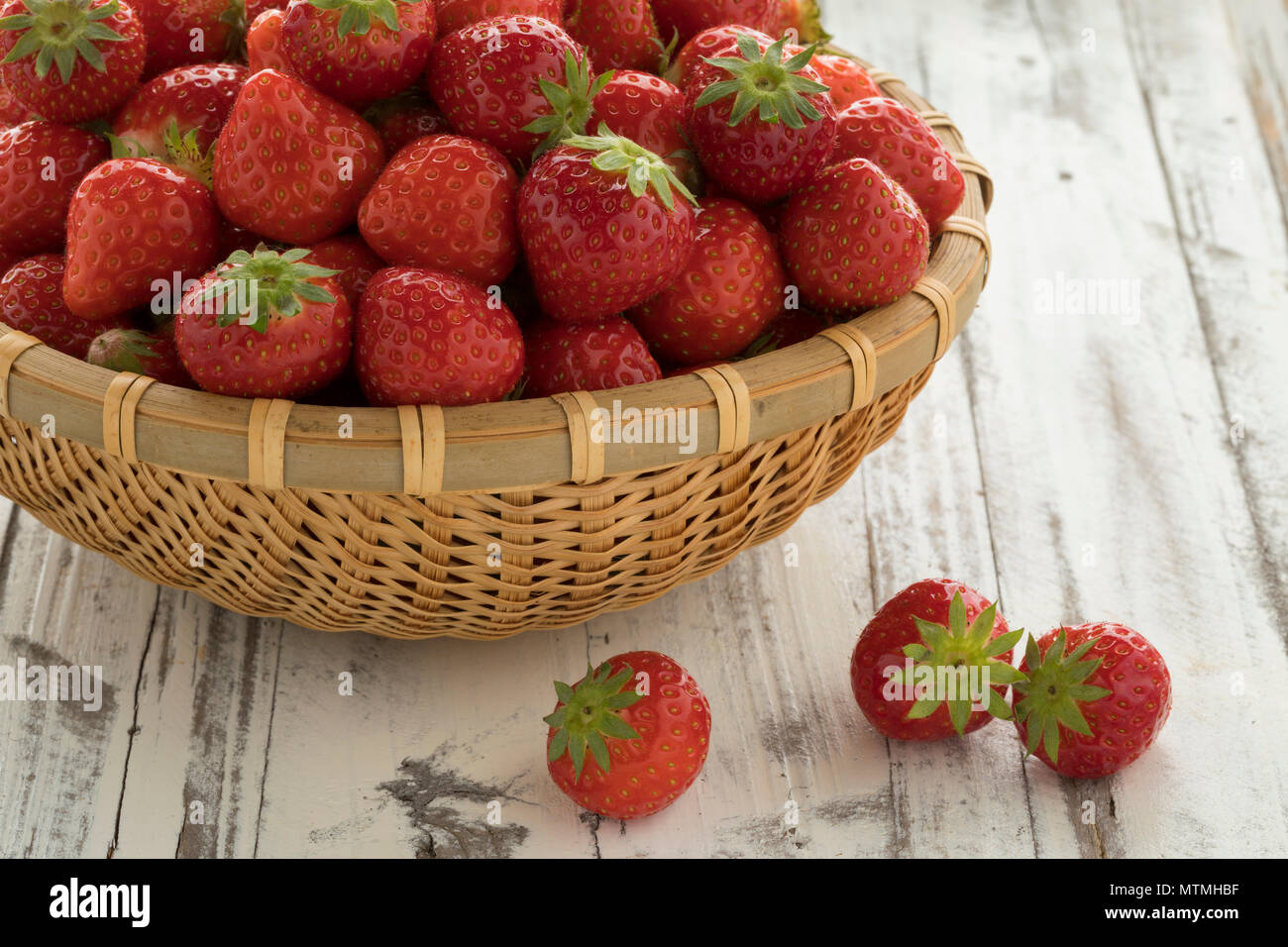 Basket with fresh ripe red strawberries for dessert Stock Photo