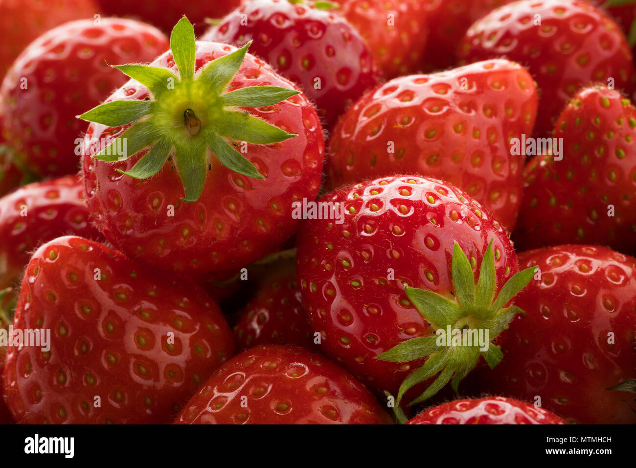 Fresh ripe red strawberries close up full frame Stock Photo