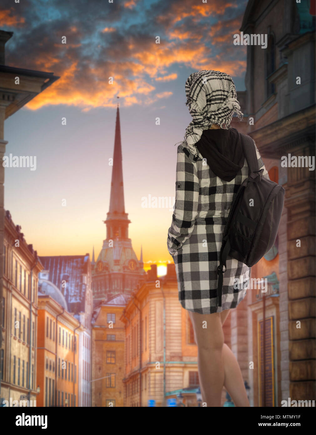 a woman with a backpack travels to Stockholm. Sweden Stock Photo