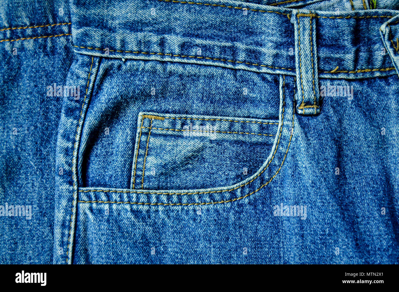 Background by blue jeans and jean lack, Close-up of jeans texture,  Wallpaper by blue denim Stock Photo - Alamy