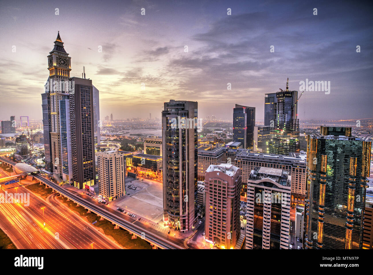 Dubai sunset panoramic view of Sheikh Zayed road. Dubai is super modern city of UAE, cosmopolitan megalopolis. Stock Photo