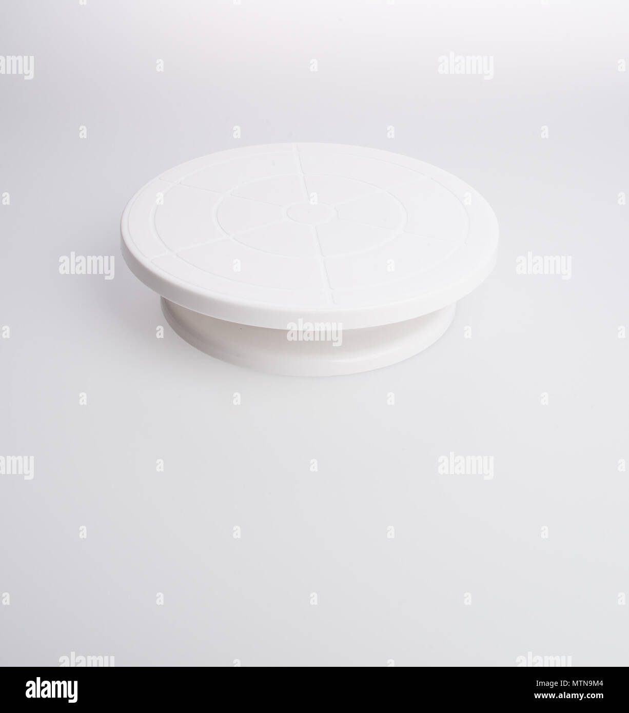 cake stand or rotating cake stand on a background Stock Photo