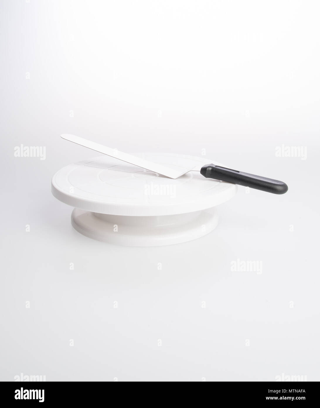 cake stand with cake spatula on a background Stock Photo