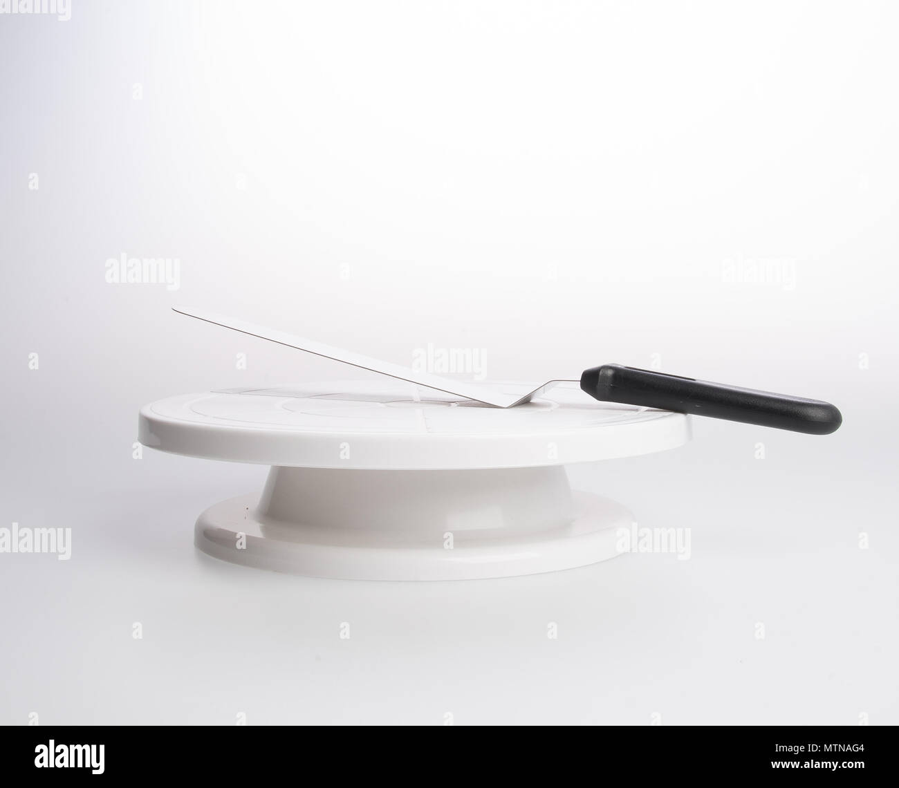 cake stand with cake spatula on a background Stock Photo