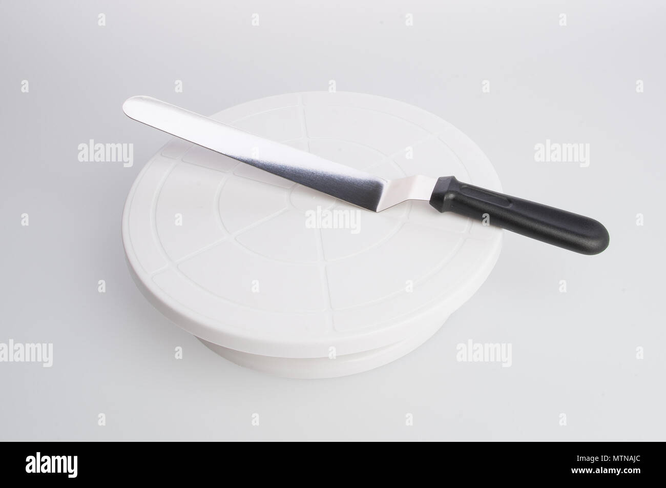 cake stand with cake spatula on a background Stock Photo