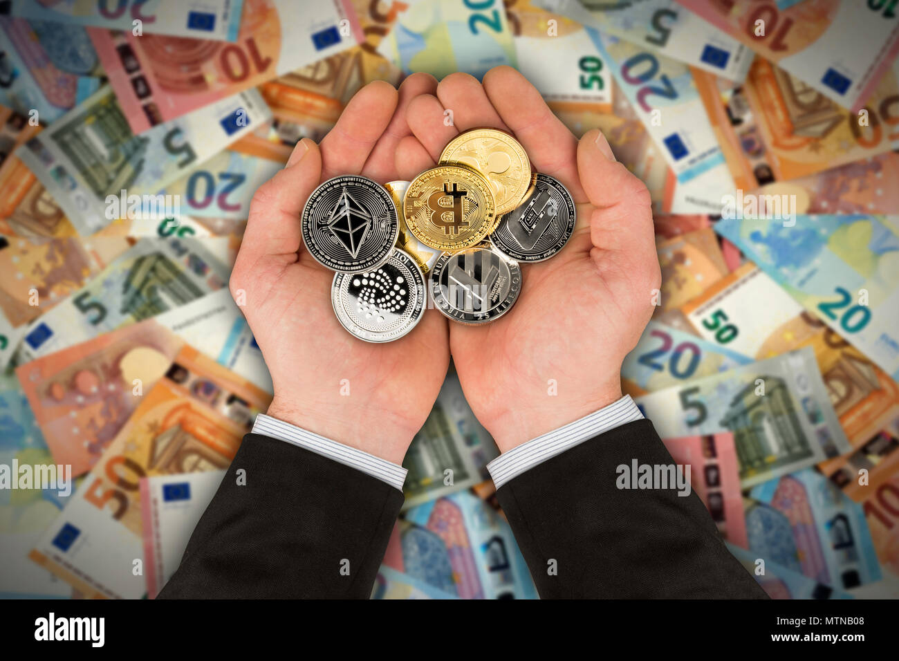 open hands of business man filled with crypto currency coins on euro bank  note background blockchain financial business investment concept bitcoin  eth Stock Photo - Alamy