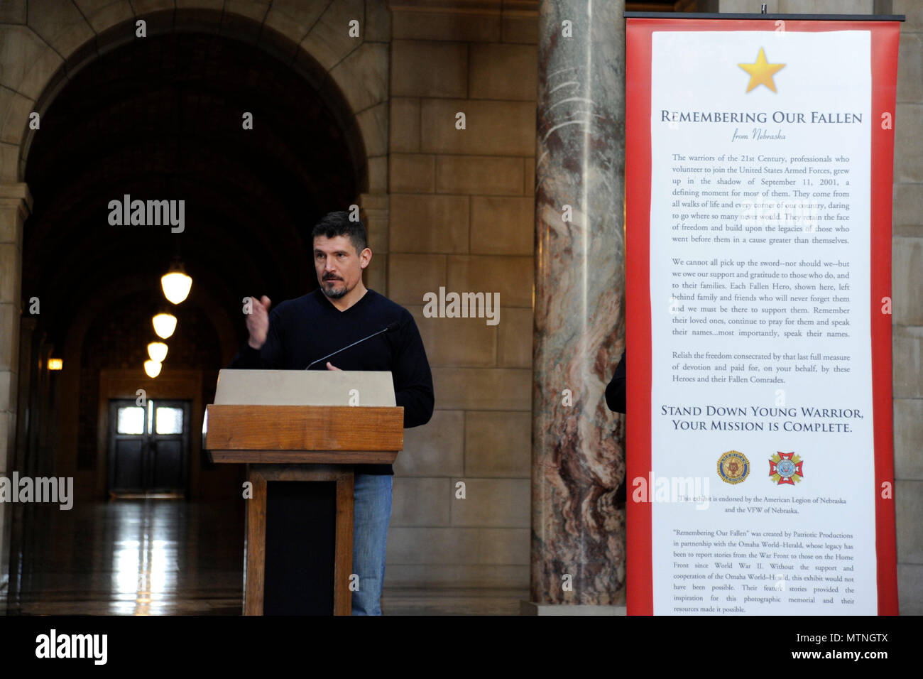 Kris “Tanto” Paronto, speaks at the State Capitol Building in Lincoln, Nebraska, Jan. 9, at a 'Remembering Our Fallen' ceremony put on by Bill and Evonne Williams of Patriotic Productions, a non-profit organization.  Paronto, a former U.S. Army Ranger from the 2nd Battalion, 75th Ranger Regiment and private security contractor, was part of the CIA annex security team that responded to the terrorist attack on the U.S. Special Mission in Benghazi, Libya, Sept. 11, 2012. Stock Photo