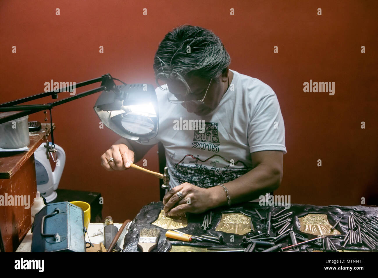 Metalworking artist in his studio, located in the Calle La Ronda, Old Town, Quito Stock Photo