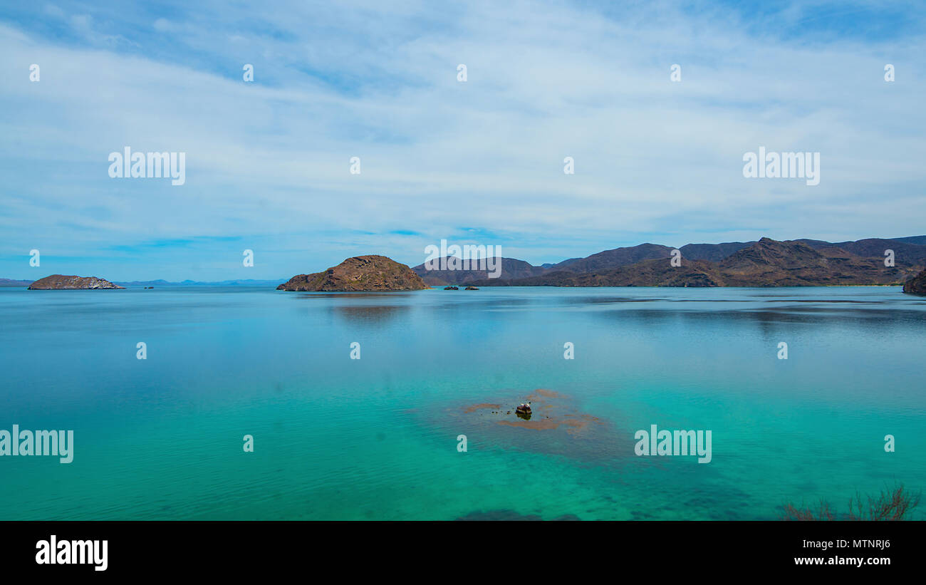 Tranquil beach paradise with calm waters for exploring the neighboring islands. Stock Photo