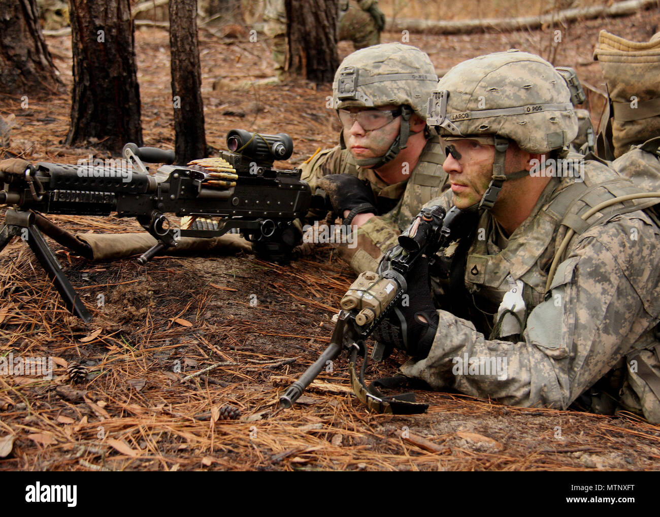 Combat team personnel engaged in intensive live-fire training for deployment readiness preparation
