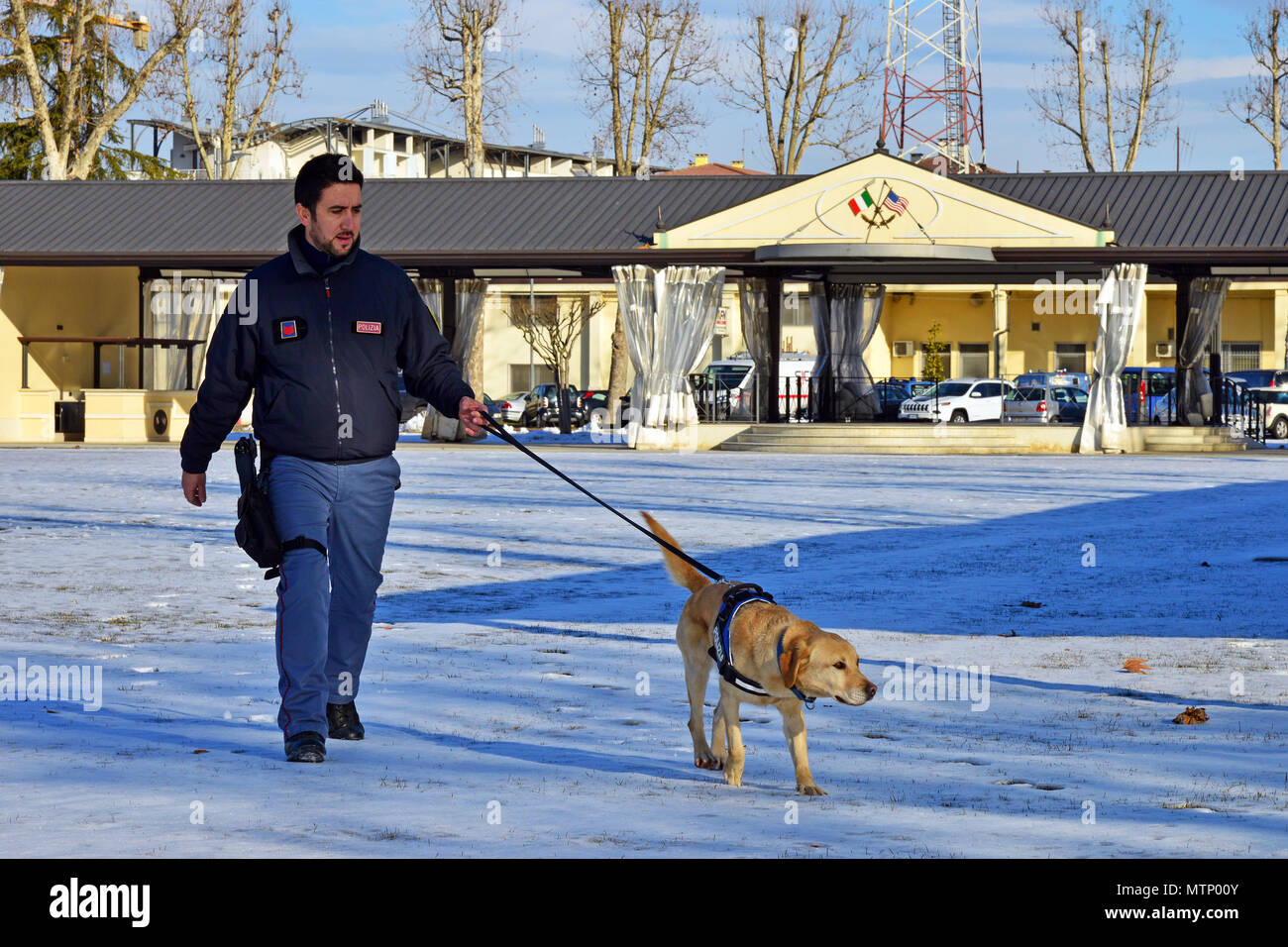 Italian military working dog Thunder and his handler Deputy Inspector Filippo Nicola, assigned to the Italian Police Squadra Cinofili K9 airport Venice, prepare to inspect areas that may have explosive residue at Caserma Ederle, Vicenza, Italy Jan. 17, 2017. Military Working Dog teams are used in patrol, drug and explosive detection and specialized mission functions for the Department of Defense and other government agencies. The 525th Military Working Dog Detachment, joint training with Italian Police Squadra Cinofili K9 airport Venice and Questura di Padova and U.S. Air Force. (U.S. Army pho Stock Photo