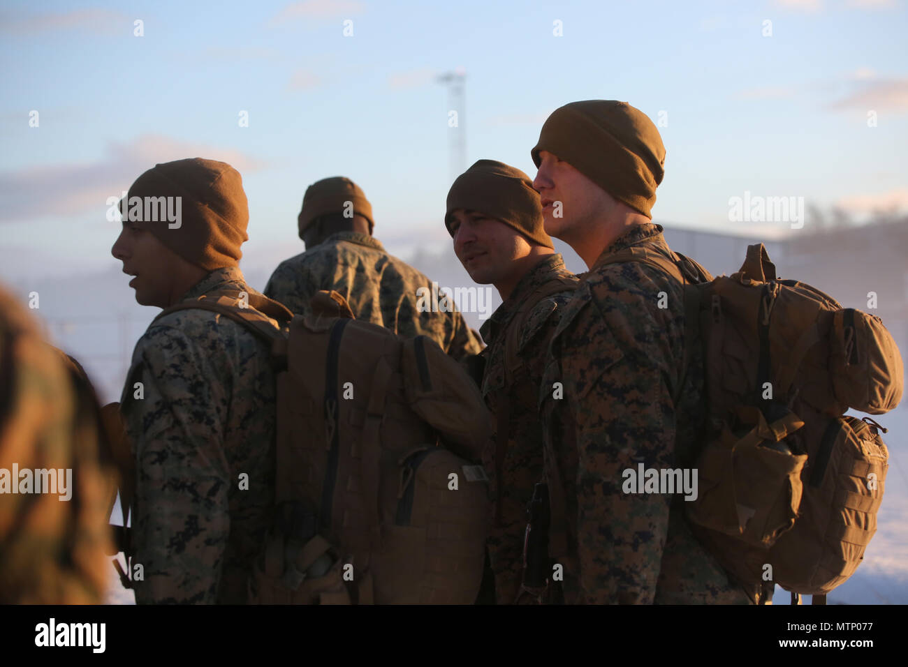 U.S. Marines make a formation shortly after disembarking the plane at Vaernes Garnison, Norway, Jan. 16, 2017. The Marines with Black Sea Rotational Force 17.1 arrived at Vaernes Garnison early in the morning as part of Marine Rotational Force Europe 17.1. (U.S. Marine Corps photo by Lance Cpl. Victoria Ross) Stock Photo