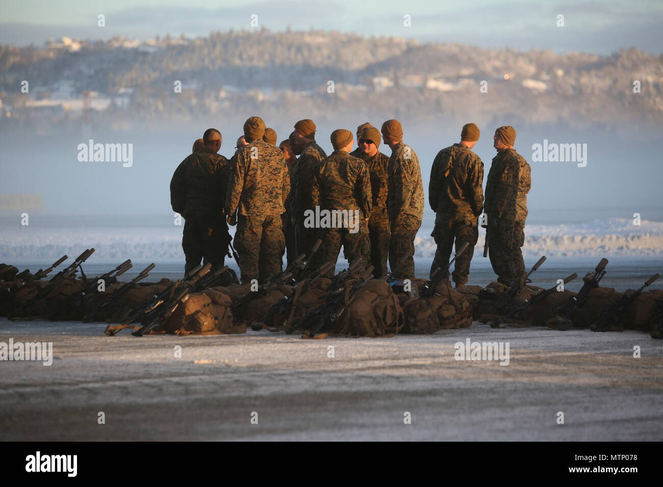 U.S. Marines stage their gear before unloading bags from the plane at Vaernes Garnison, Norway, Jan. 16, 2017. The Marines with Black Sea Rotational Force 17.1 arrived at Vaernes Garnison early in the morning as part of Marine Rotational Force Europe 17.1. (U.S. Marine Corps photo by Lance Cpl. Victoria Ross) Stock Photo