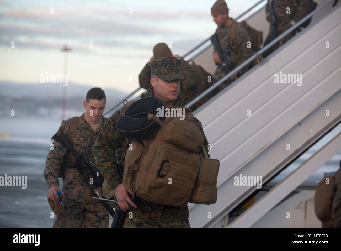 U.S. Marines disembark the plane at Vaernes Garnison, Norway, Jan. 16, 2017. The Marines with Black Sea Rotational Force 17.1 arrived at Vaernes Garnison early in the morning as part of Marine Rotational Force Europe 17.1. (U.S. Marine Corps photo by Lance Cpl. Victoria Ross) Stock Photo
