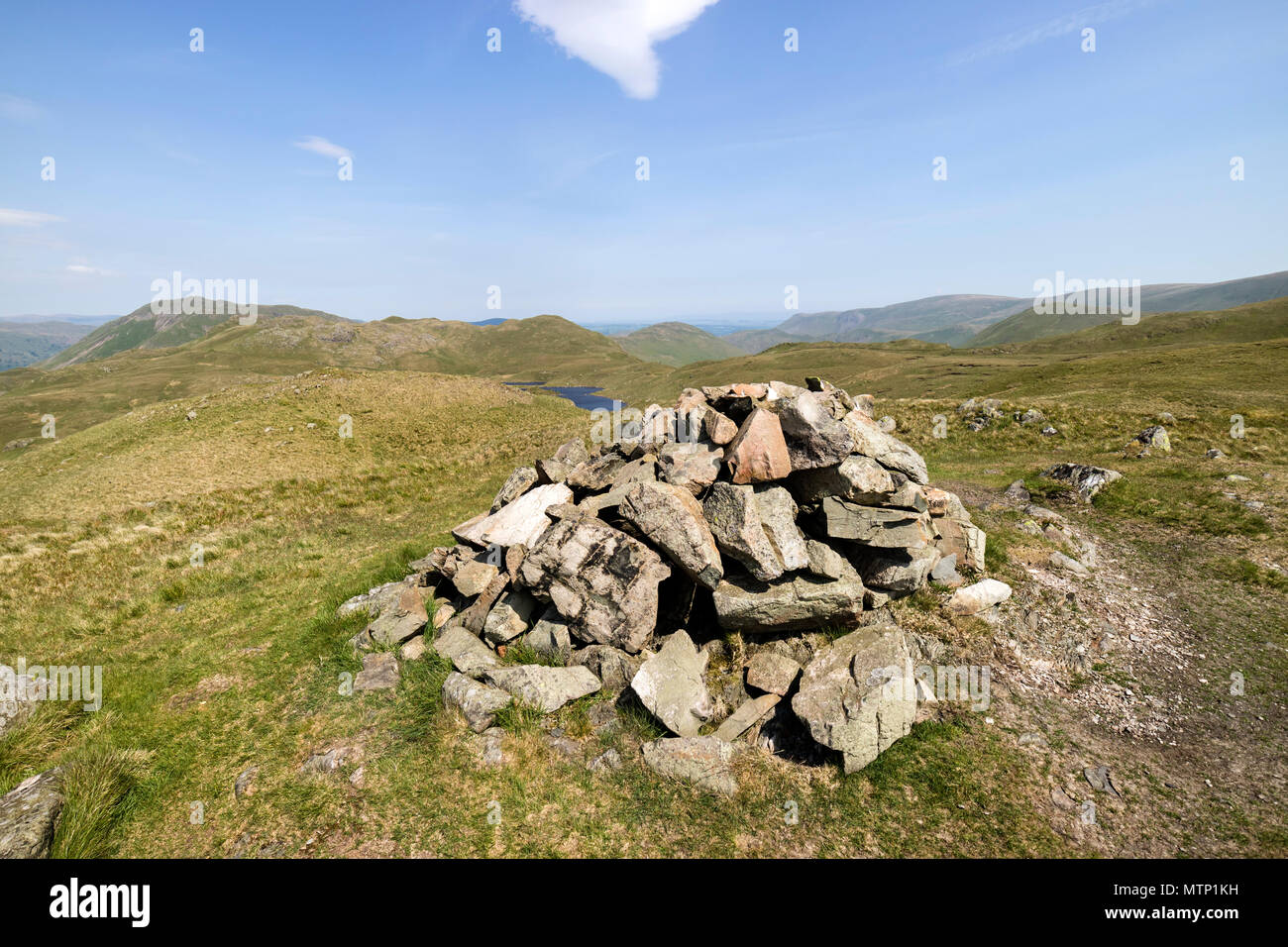 The Summit Cairn of Brock Crags with the View Towards Angle Tarn, Lake District Cumbria, UK. Stock Photo
