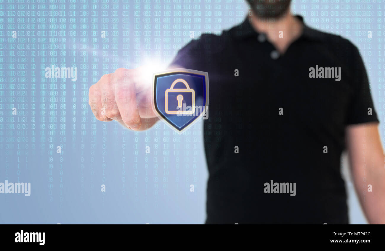 man touching data security or data privacy icon on translucent screen with binary code Stock Photo
