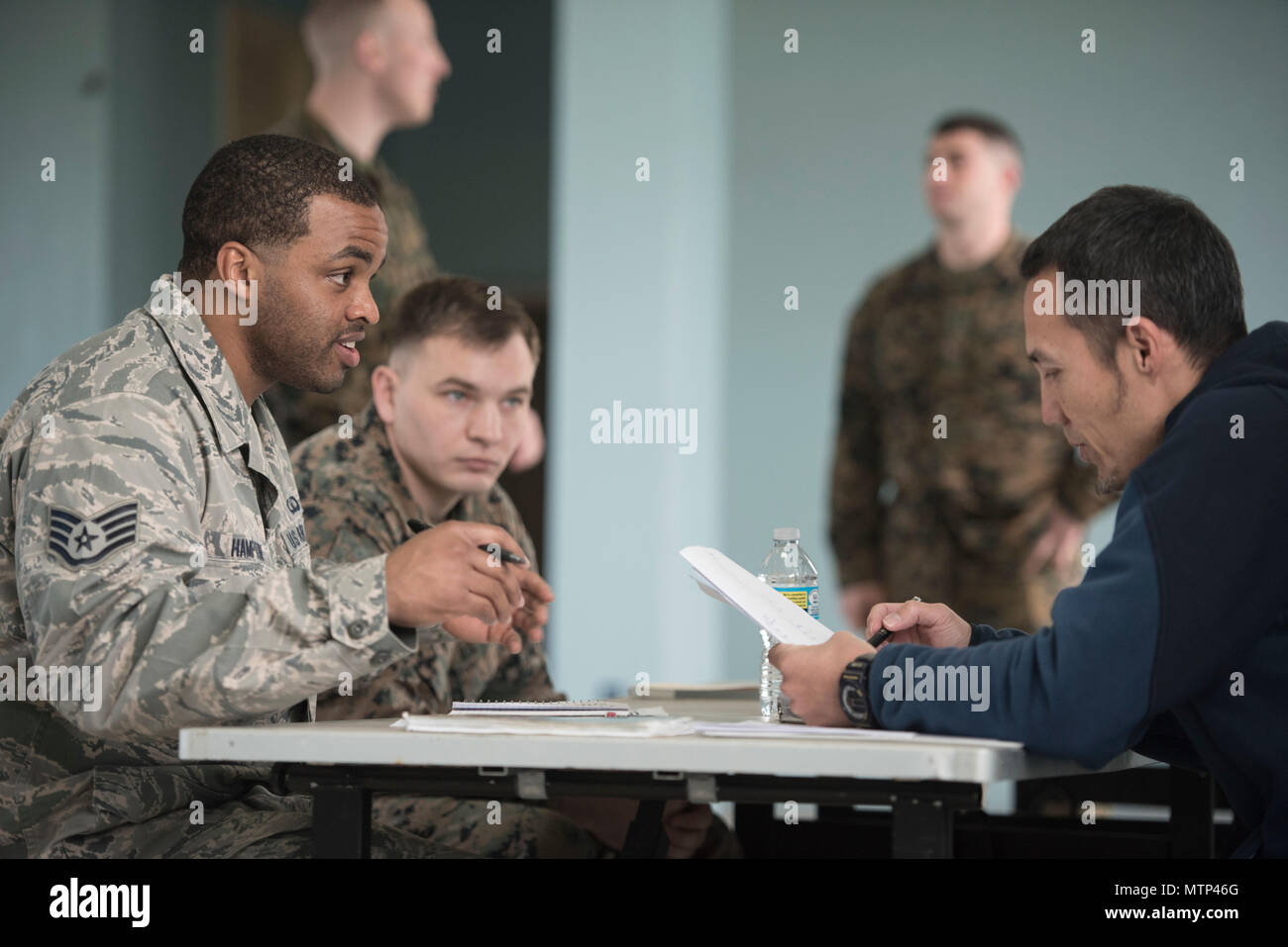 U.S. Air Force Staff Sgt. Lewis Hampton and Nichalos Apsens, 18th